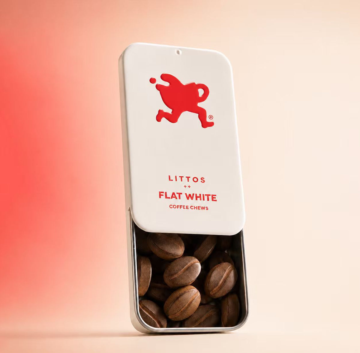 A metal tin of Littos Flat White coffee chews photographed against a plain background, showing the product name and branding on the tin.